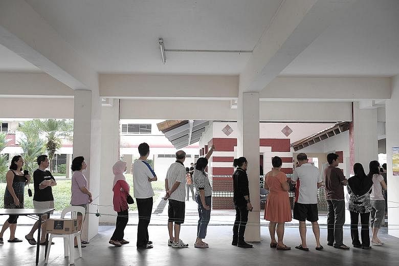 Voters waiting for their turn at a polling station in Hougang during the 2011 General Election. When the Electoral Boundaries Review Committee is convened months before a general election, the ELD, which celebrates its 70th anniversary this year, doe