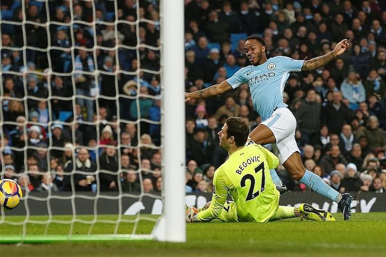 Manchester City forward Raheem Sterling slotting past Bournemouth 'keeper Asmir Begovic for the second goal in their 4-0 rout on Saturday. With 12 league goals, the England international is enjoying his best return yet.