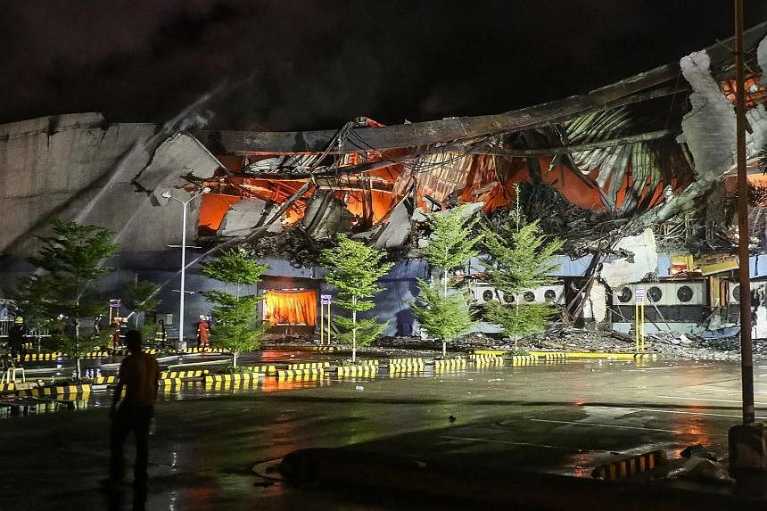 The blaze at the four-storey NCCC Mall in Davao, southern Philippines, was brought under control early yesterday but fire officials said they had yet to enter the section where the missing were believed to be trapped. Philippine President Rodrigo Dut