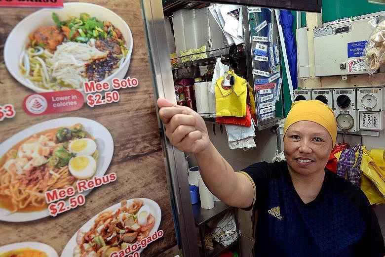 Madam Julina Ahmad's stall in New Upper Changi Road offers healthier options. The Health Promotion Board has expanded the Healthier Dining Programme, so people can easily identify the better option.