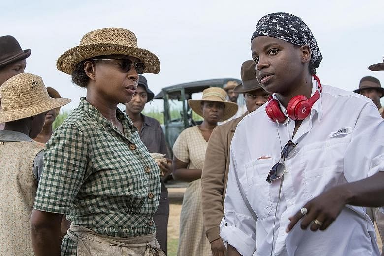 Mudbound (above) is set in a farm in Mississippi. Director Dee Rees (left) and actress Mary J. Blige (far left) on the film set.