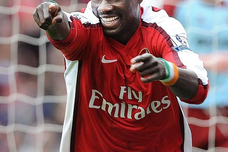 Former Arsenal right-back Emmanuel Eboue in happier days playing at the Emirates Stadium. A divorce court ruling awarded all his assets to his former wife, leaving the Ivorian with nothing to his name.