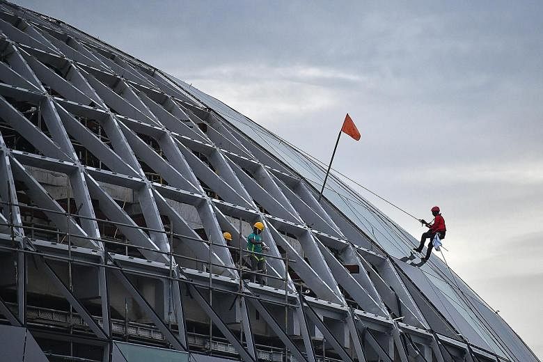 Work on Jewel Changi Airport is moving ahead at full-speed, with construction workers seen scaling its external facade on Tuesday. The complex is scheduled to open in early 2019, and will have five storeys above ground and five basement levels, with 