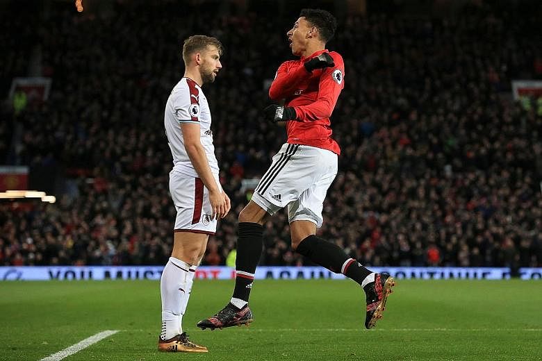 Manchester United midfielder Jesse Lingard (with Burnley's Charlie Taylor) celebrating pulling a goal back for the Red Devils on Tuesday after the visitors took a two-goal lead. Lingard then scored an injury-time equaliser which denied the Clarets th