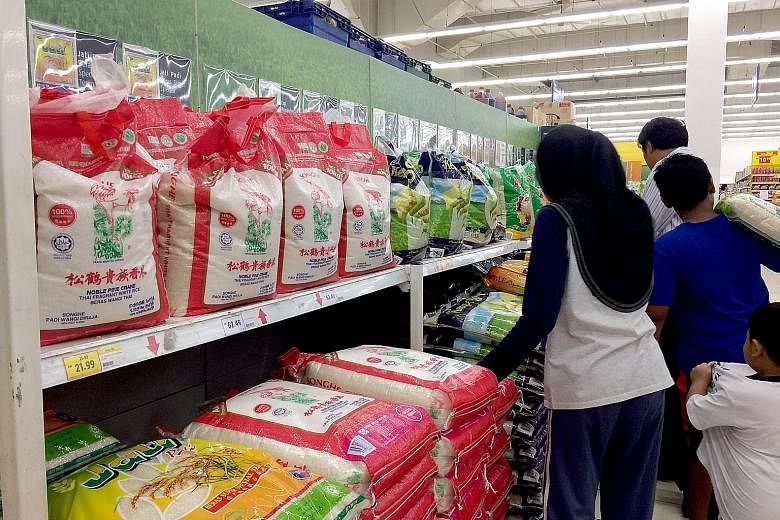 Packaged rice in a Kuala Lumpur supermarket. Most rice brands are linked to national rice agency Bernas.