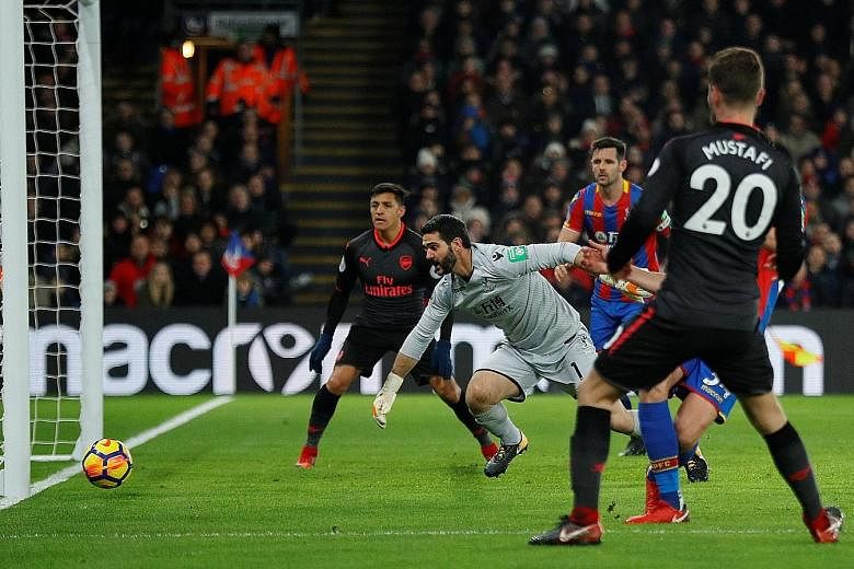 Arsenal's Shkodran Mustafi equalising against Crystal Palace at Selhurst Park in London on Thursday. Alexis Sanchez then scored twice in Arsenal's 3-2 victory.