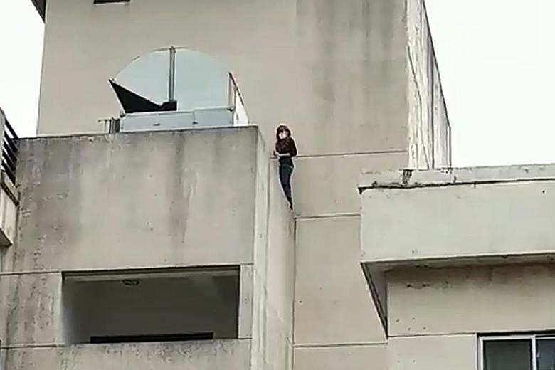 The Singaporean woman tried to jump off a building in Taoyuan, Taiwan, on Thursday.