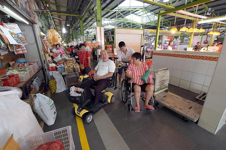 Mr Francis Tan, 80, who uses a personal mobility device to get about, welcomes the wider walkways and accessibility ramps at the newly renovated Bukit Merah View Food Centre and Market. Other new features include free Wi-Fi, slip-resistant flooring, 