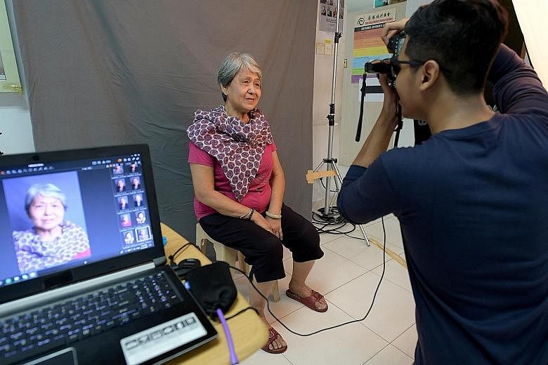 Madam Ang Cheng Boey having her portrait taken at Nam Hong Welfare Service Society. The photos of the elderly beneficiaries will be printed and given to the seniors, who can use them in any way they like, including for their funeral service.
