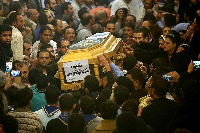 Mourners at the funeral of a victim of the Mar Mina Coptic Church attack in Cairo last Friday.