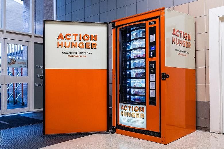 An Action Hunger vending machine stocked with free food and clothing for the homeless in Nottingham, England. The charity hopes to expand across Britain as well as in Europe and the US.