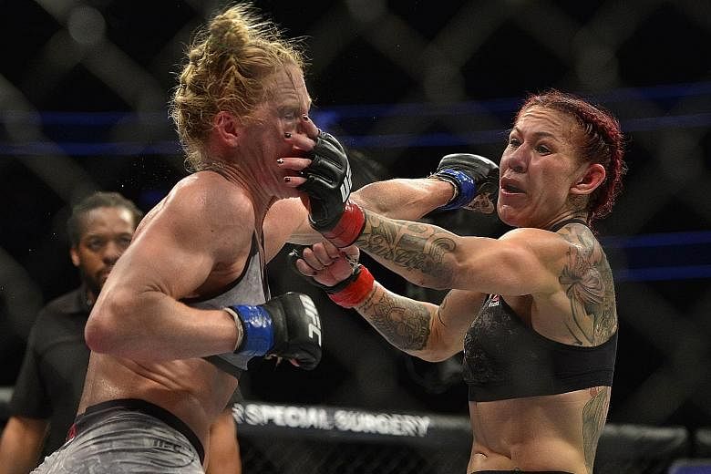 Cris Cyborg landing a hit against American Holly Holm during UFC 219 at the T-Mobile Arena in Las Vegas on Saturday. The 32-year-old Brazilian retained her Ultimate Fighting Championship (UFC) featherweight title with a unanimous-decision victory. Th