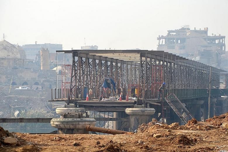 Mosul's Old Bridge is undergoing repair work. For millions of residents in Mosul and the broader region, the disappearance of the bridges they used to rely on has turned daily life into an arduous obstacle course.