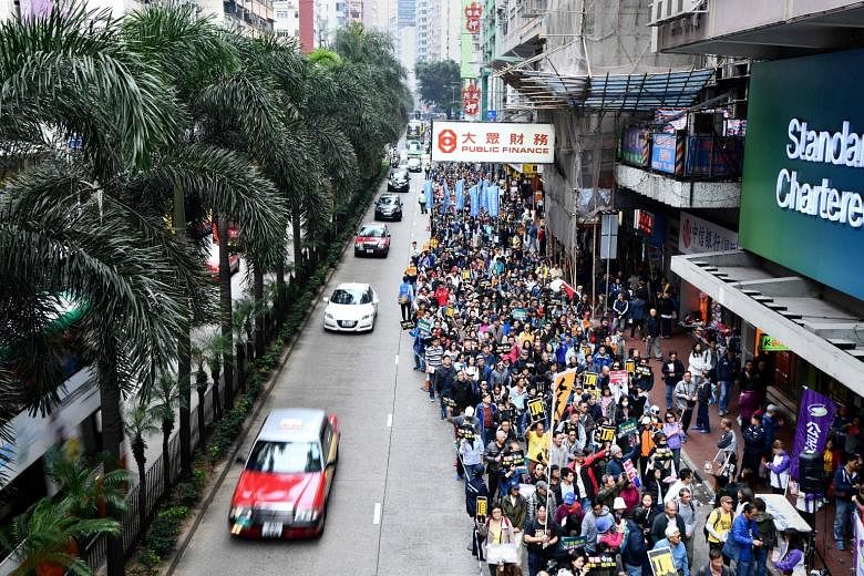 Hong Kongers protesting against "suppression" by Beijing yesterday, days after the Chinese authorities ruled that part of a city rail station would come under mainland law.