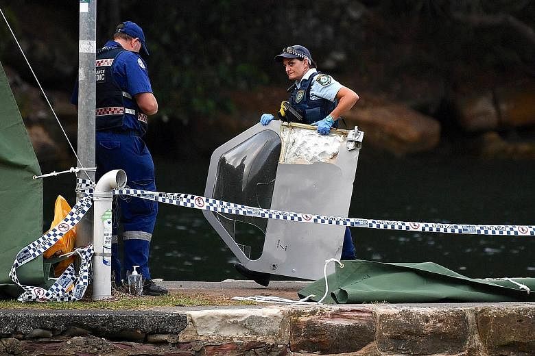 Above: Debris from the seaplane that crashed into the Hawkesbury River, north of Sydney, on Sunday. The pilot was among the six people killed. Left: The plane belonged to Sydney Seaplanes, which has operated since 2005 with no previous accident recor