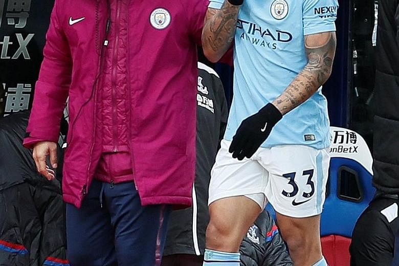 City's Gabriel Jesus going off after injuring his knee. He could be out for up to two months.