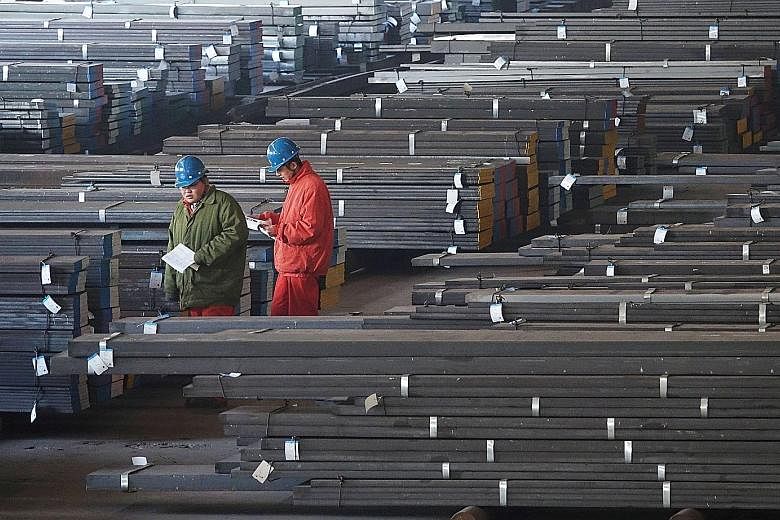 Workers checking steel bars at a factory in Dalian, Liaoning province. In China, manufacturing growth unexpectedly picked up to a four-month high in December amid a surge in new orders, suggesting continued strength in global trade.