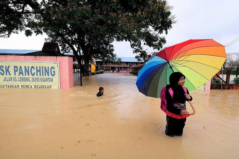 Eleven schools in Malaysia's eastern state of Pahang were forced to close yesterday - the first day of the new school year - because floodwaters had inundated their grounds or cut off their access roads.