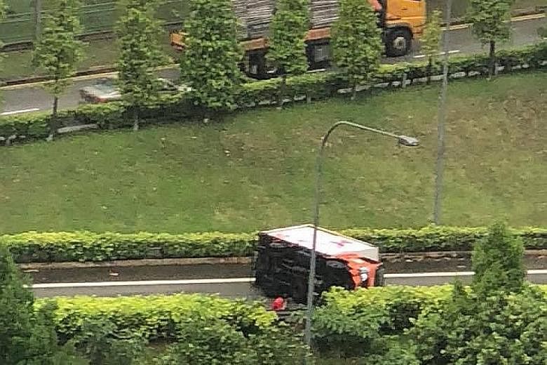 This lorry overturned and blocked the slip road leading into the Tampines Expressway. The accident happened at 2.38pm, police told The Straits Times. There was no report of anyone being injured.