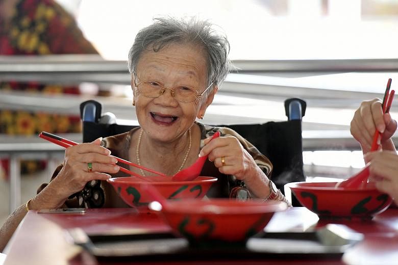Madam Mung Kuai Ho, 87, having breakfast at the revamped hawker centre. Its reopening means she can return to her much-loved routine of eating there. The newly reopened market and hawker centre has widened walkways, accessibility ramps, slip-resistan