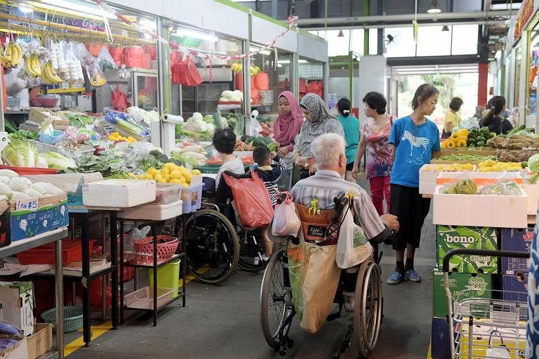 Madam Mung Kuai Ho, 87, having breakfast at the revamped hawker centre. Its reopening means she can return to her much-loved routine of eating there. The newly reopened market and hawker centre has widened walkways, accessibility ramps, slip-resistan