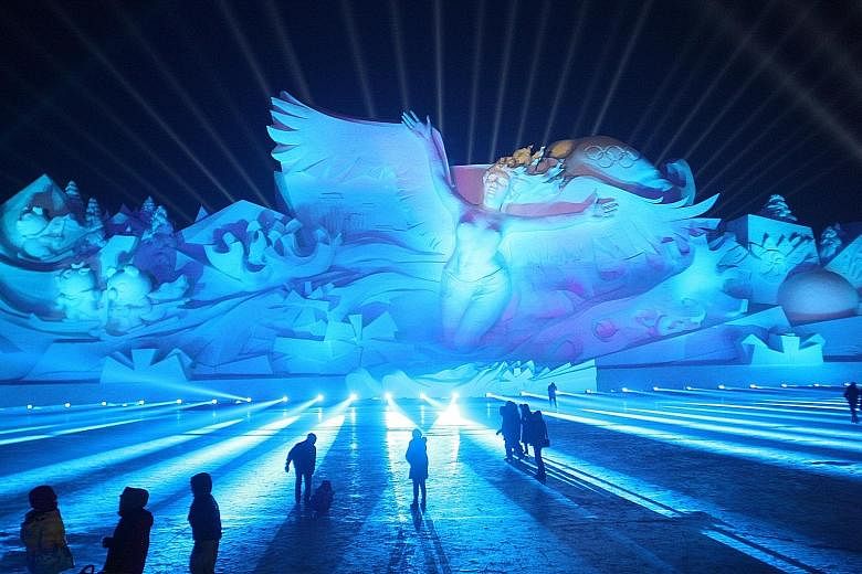 Visitors being treated to a 3D light show at the Sun Island International Snow Sculpture Art Expo in Harbin, capital of north-east China's Heilongjiang province. The Snow Wonderland show combines sound, light and digital technologies, and is being he