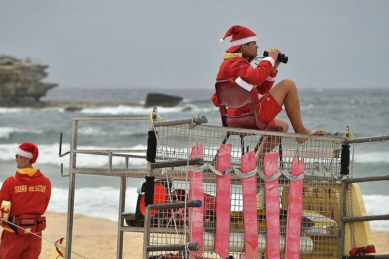 Lifeguards on patrol on Christmas Day at Sydney's Bondi Beach last month. A total of 291 people drowned in Australian waters last year. Of these, 20 were overseas visitors and eight were students. Eight of the tourists who died were from Asia.