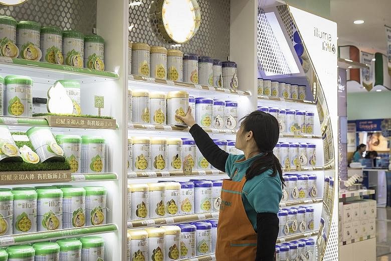 Cans of Illuma infant formula, produced by Nestle, at a Shanghai store. New rules in China governing the formula milk industry make it easier for foreign brands like Nestle to grab a greater share of a huge market.