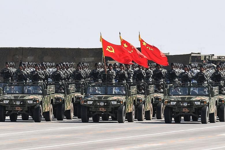 PLA soldiers during a parade at the Zhurihe training base in China's northern Inner Mongolia region last July. President Xi Jinping wants more tech use, scientific education for troops and options to build an elite and inventive military. The PLA's r
