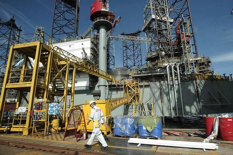 A worker at the Keppel FELS Pioneer Yard. Keppel Offshore & Marine and its US subsidiary were slapped with criminal penalties of US$422 million two weeks ago for paying US$55 million in bribes to Brazilian officials.