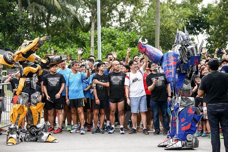 Giant robots descended on Palawan Beach in Sentosa alongside more than 3,500 people in the first Transformers Run Singapore yesterday. Vulnerable families, volunteers and people with disabilities were among those who took part in the 5km fun run and 