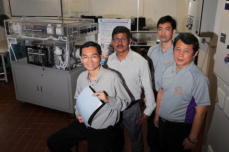(From far left) Associate Professor Ernest Chua, 48, holding a membrane sheet used in the Membrane Dehumidification Module; Dr Md Raisul Islam, 52, senior lecturer; Dr Bui Duc Thuan, 37, research fellow; and Dr M Kum Ja, 47, senior research fellow be