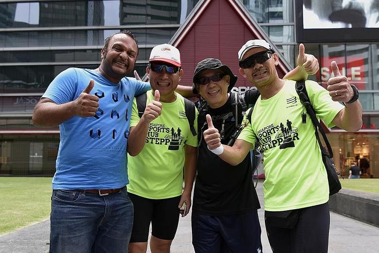 (From far left) Mr Vijay Kumar, organiser of the walk, with participants Ong Chin Bok, Steven Chee and Alex Quah, who completed the full 100km yesterday. More than 150 people participated in the event, with 27 making it to the 50km mark at Waterway P