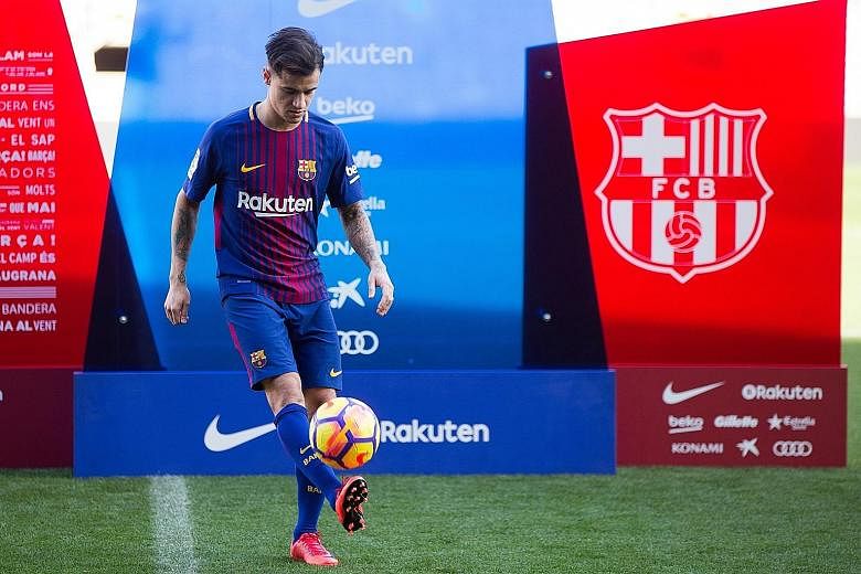 Brazilian star Philippe Coutinho entertaining more than 7,000 fans who had turned up at the Nou Camp to watch his unveiling as a Barcelona player yesterday.