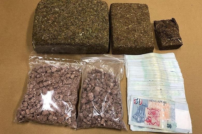 The cannabis, heroin and cash that were seized in the Central Narcotics Bureau operation on Monday.