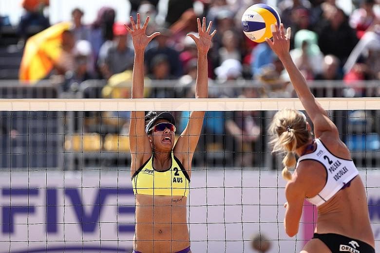 Taliqua Clancy of Australia attempting to block a spike from Poland's Katarzyna Kociolek during the final of the FIVB Beach Volleyball World Tour Qinzhou Open last October. Singapore is set to play host to some of the world's top beach volleyball pla
