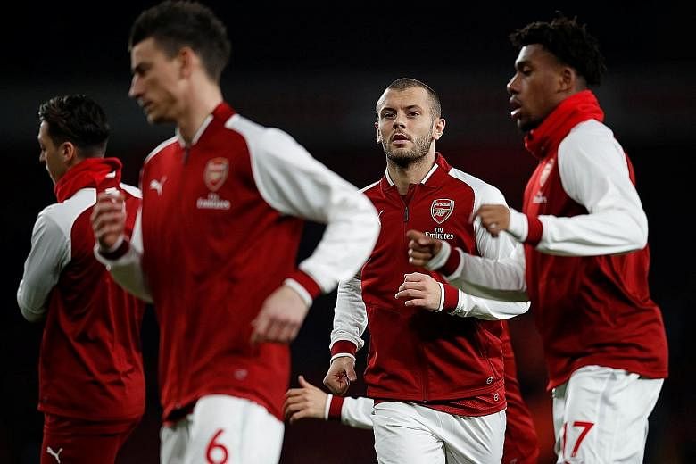 From left: Arsenal's Laurent Koscielny, Jack Wilshere and Alex Iwobi in training. Wilshere along with Mesut Ozil and Alexis Sanchez are all out of contract in the summer, with the club no closer to extending their deals.