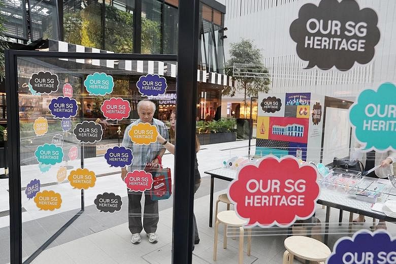 At the travelling roadshow at Raffles City Shopping Centre, visitors can learn about Singapore's first national heritage plan and give feedback.