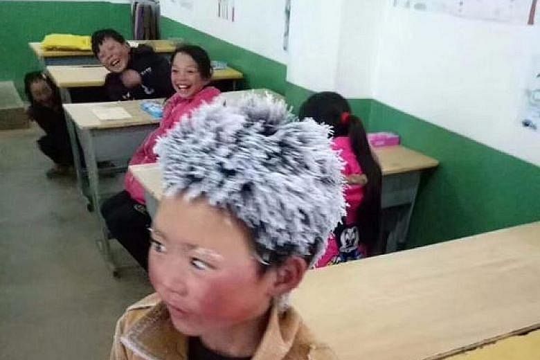 Eight-year-old Wang Fuman in China's Yunnan province braved minus 9 deg C conditions, walking 4.5km for an hour from his home to his school. The temperature had plunged while the boy was already on his way.