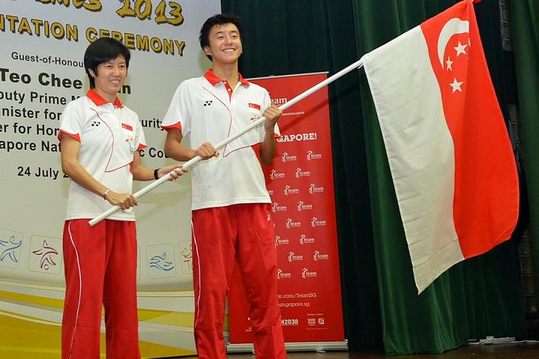 Chef de mission Tan Paey Fern and flag-bearer Quah Zheng Wen at the 2013 Nanjing Asian Youth Games flag presentation ceremony. The former national paddler will reprise her role for the Feb 9-25 Pyeongchang Games.