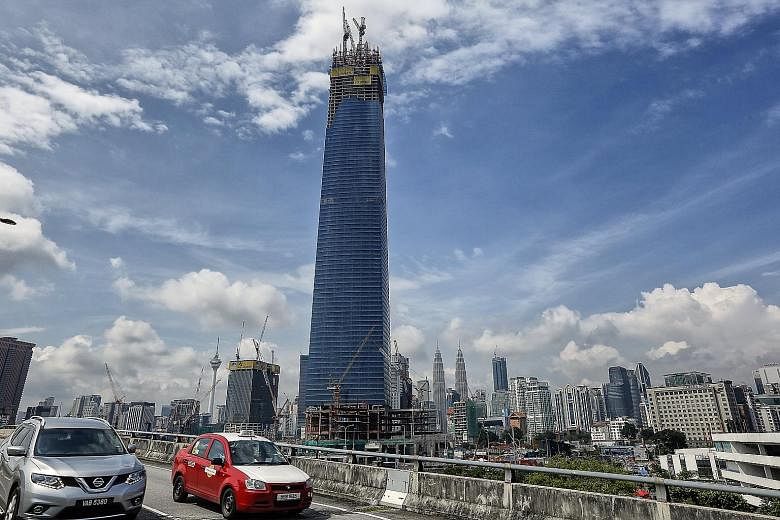 The 106-storey The Exchange 106 in Kuala Lumpur, slated for completion by the end of this year, will be 40m taller than the landmark Petronas Twin Towers (centre, in the background), which is currently Malaysia's tallest skyscraper.