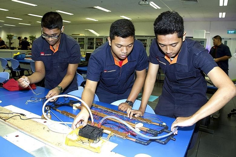 ITE College West students working on a project. ITE courses are designed to equip students with the skills they need for jobs related to their training.
