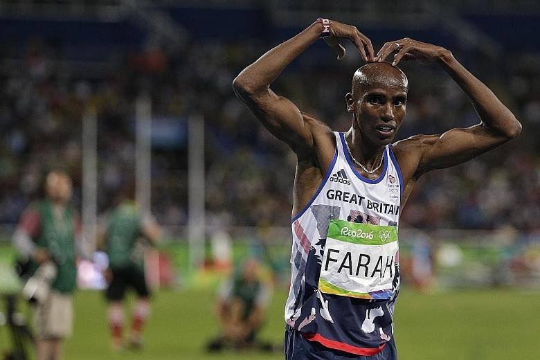 Mo Farah showing (Mobot) love to the spectators after his 10,000m victory at the 2016 Rio Olympics. Four-time Olympic gold medallist Mo Farah (centre) posing for photographs on Friday after the annual Doha Marathon in Qatar. The Briton plans to compe