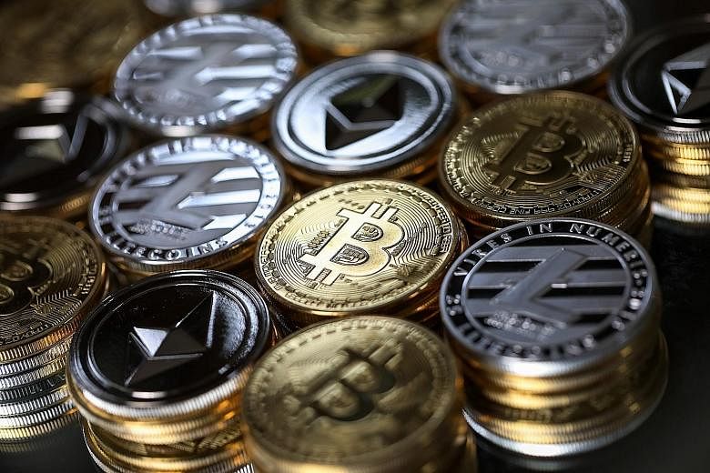 A collection of bitcoin, litecoin and ethereum tokens. "(Cryptocurrency) is not a legal medium of exchange," says Jakarta.