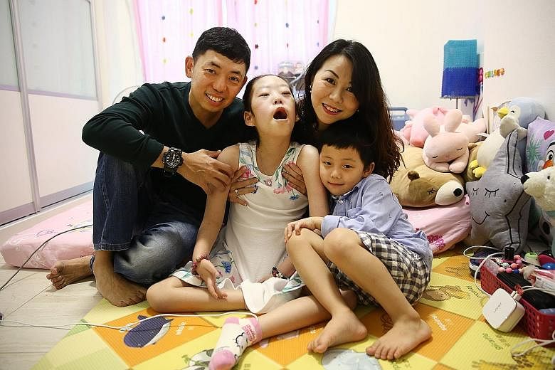 Mr Kenneth Mah and his wife Patricia with their children Chloe and Cayden. Nine-year-old Chloe has Pompe disease, which currently has no cure and can be fatal. Her treatment now easily reaches $40,000 a month.