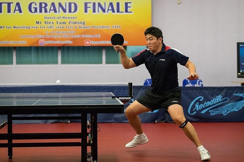 Gao Ning in action in the men's singles final of the Singapore Table Tennis Association (STTA) National Table Tennis Grand Finale yesterday at its Toa Payoh headquarters. The 35-year-old beat team-mate Ethan Poh 4-1 (14-16, 11-9, 11-6, 11-8, 11-5) to