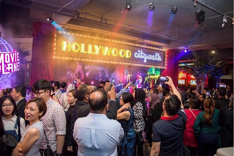 Guests at the Hollywood City Walk, an attraction at Movie Planet, one of the highlights at Capital World's theme park. Several key attractions were introduced at the official launch of Malaysia's biggest indoor theme park concept last Saturday.