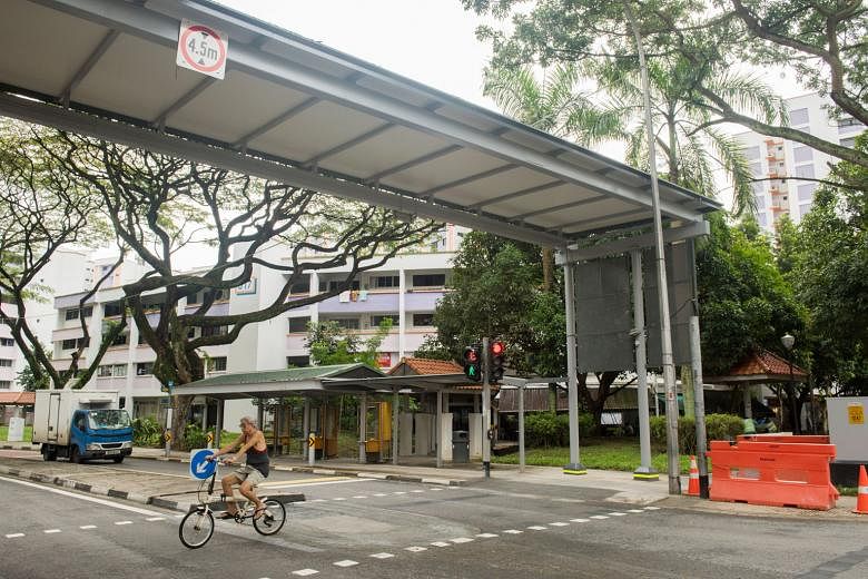 The pedestrian crossing and the shelter not in alignment (left) and the crossing now shifted under the shelter (right), at the entrance of Rulang Primary School in Jurong West Street 52. The photo showing the misalignment had gone viral on Facebook l