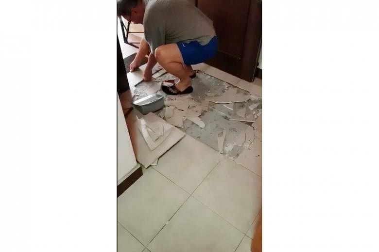 Bukit Panjang resident Rachel Chong posted a video on Facebook of tiles that had popped out and fallen from her kitchen wall (left), while the living room floor tiles in Mr Johnson Ng's Sengkang flat popped up yesterday morning. In the past two years