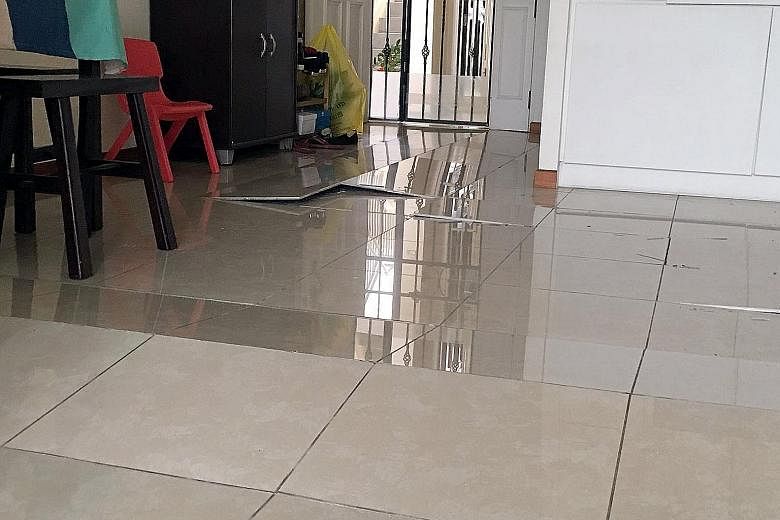 Residents in a Woodlands estate have shared photos of popped tiles in their flats in a WhatsApp chat group. Mr Lewis Sua, who lives at Block 688C, Woodlands Drive 75, said there were at least 14 flats affected in his block alone, and 38 if he include